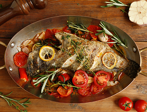 Whole fish with tomatoes and herbs
